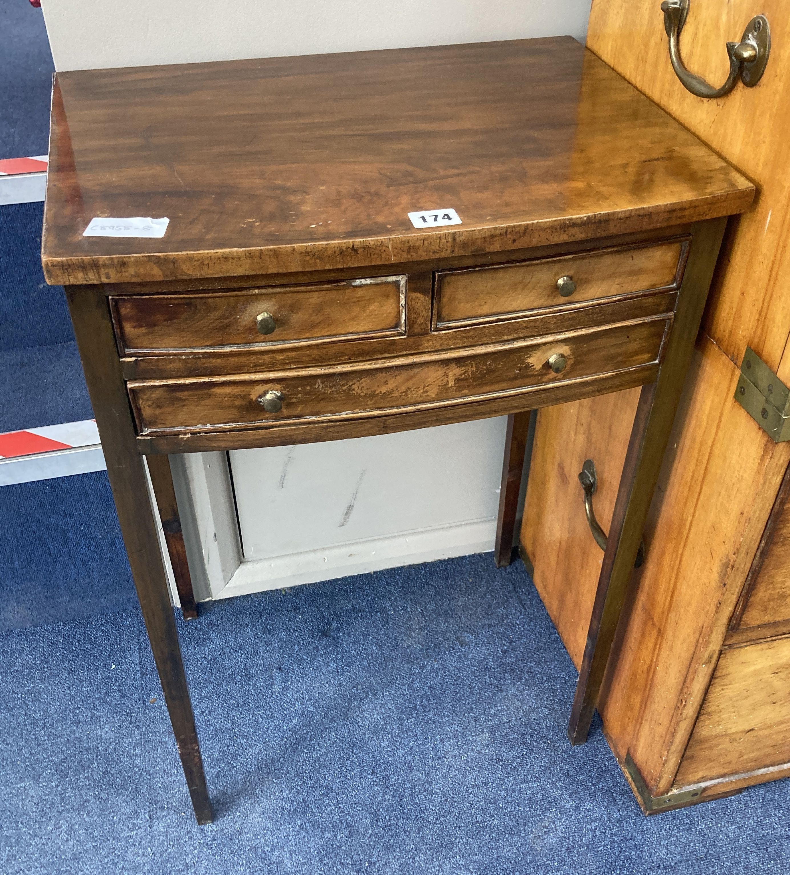 A George III style mahogany side table, fitted one long and two small drawers, width 48cm, depth 37cm, height 68cm